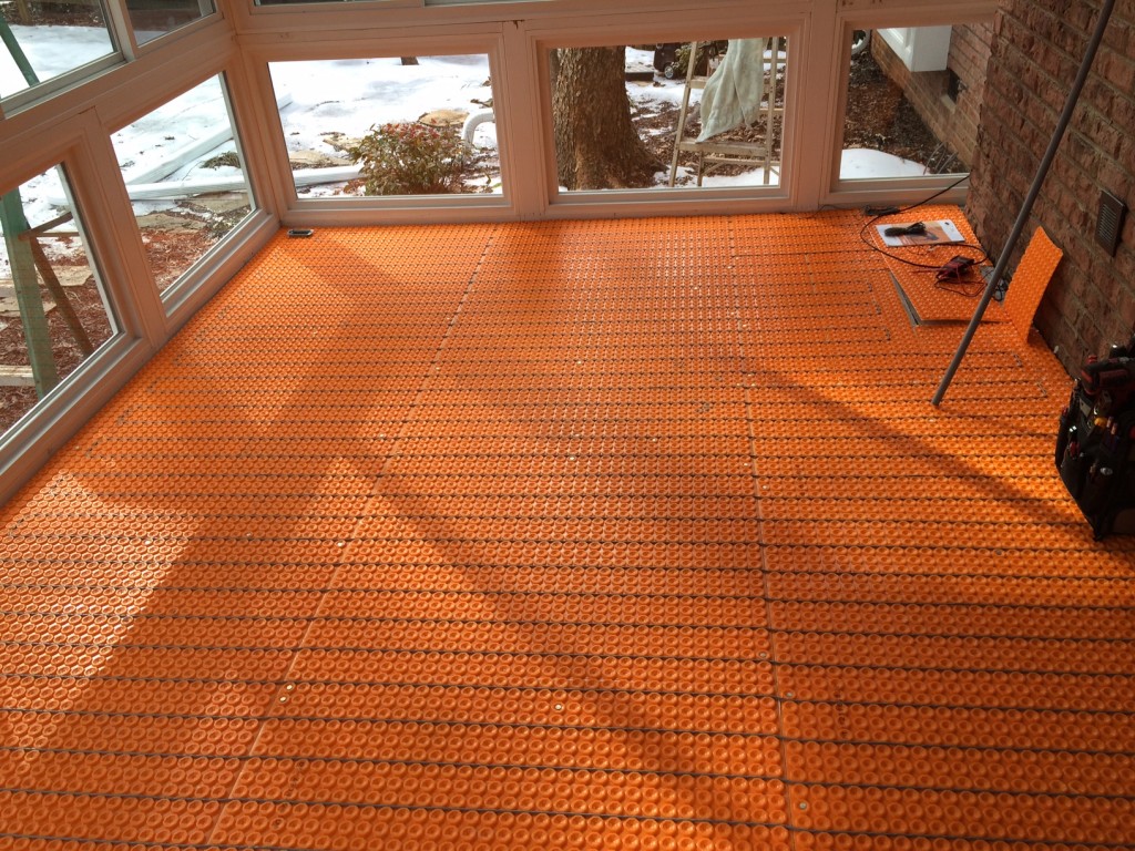 Belk Buiders installs the heated ceramic tile floor: