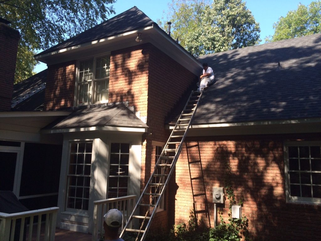 Belk Builders installing Hardie trim and repainting home in Huntesville.
