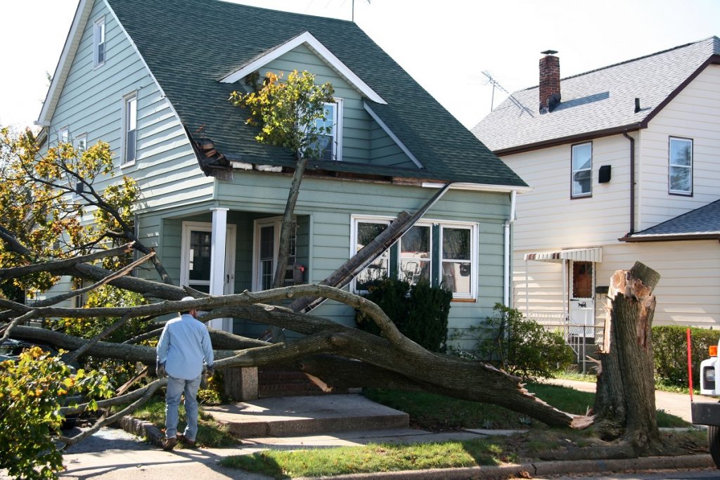 Storm damage to home exterior siding and roof