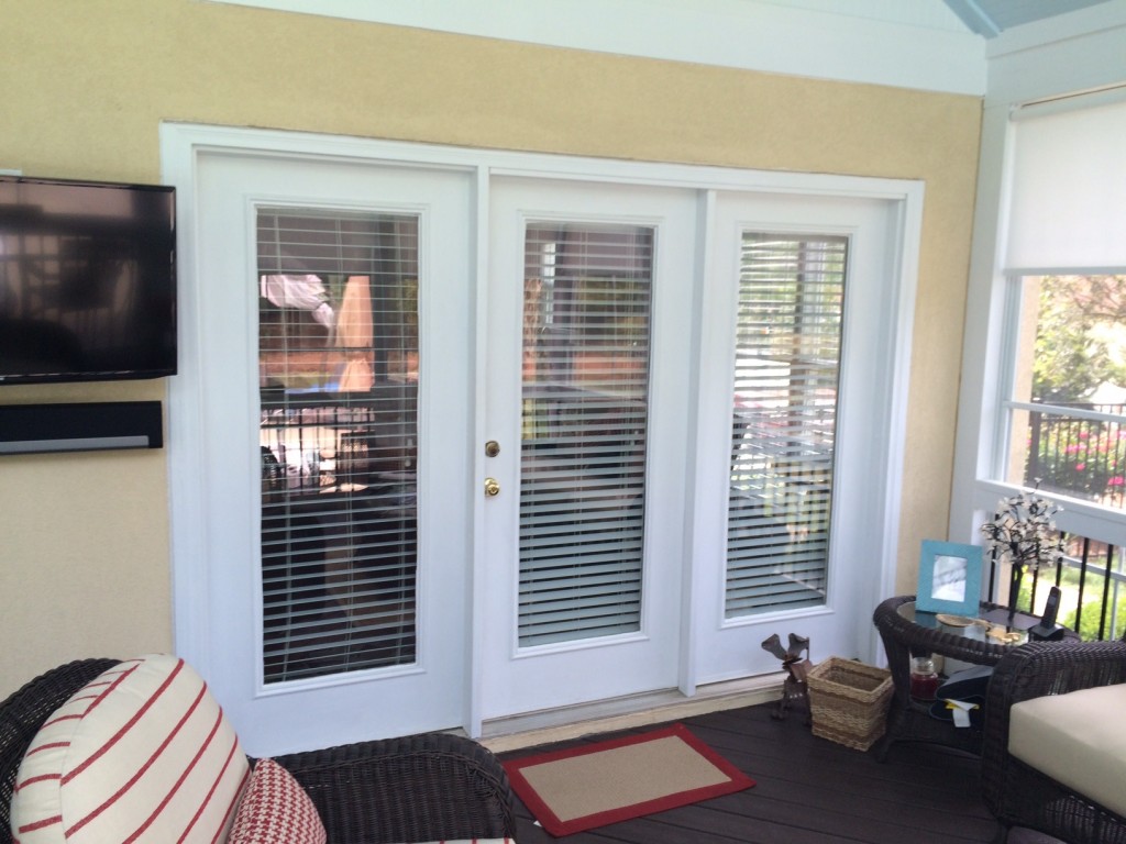 In addition to replacing the windows, the homeowners decided to exchange their cumbersome French door into their kitchen from the screened porch with a new, space-saving sliding glass door.