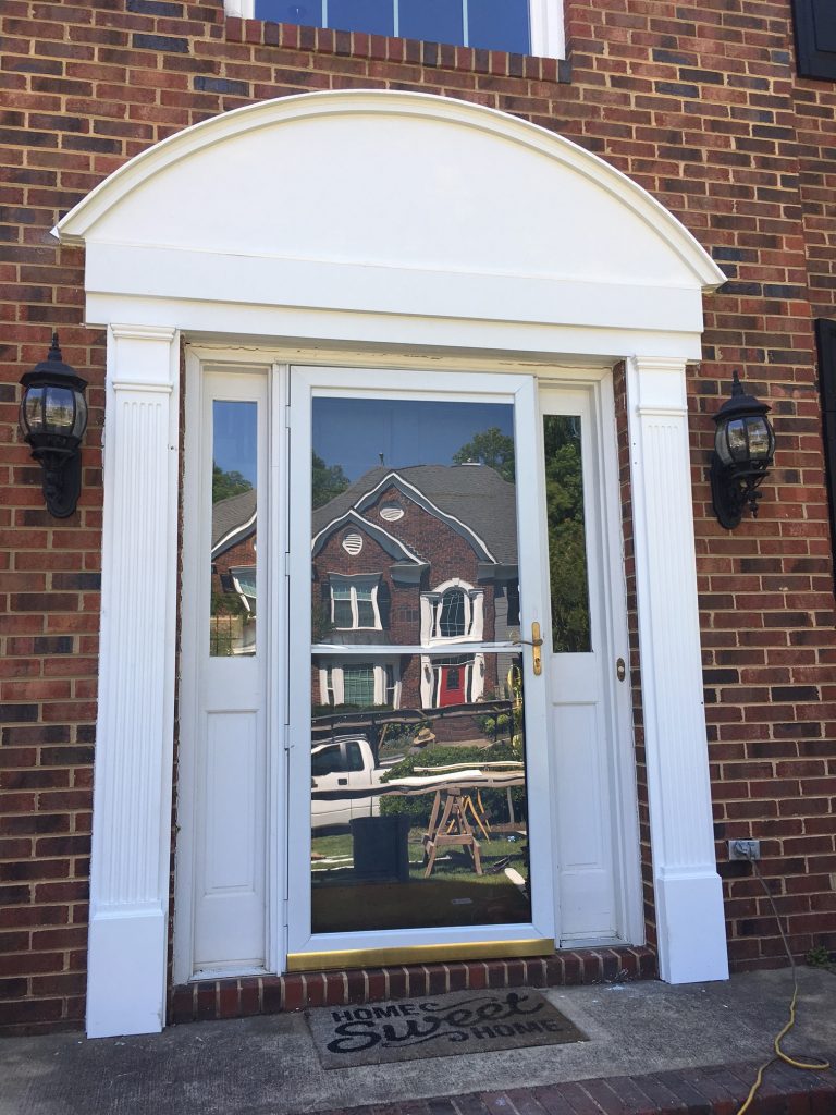 This custom made Hardie and PVC door surround is low maintenance and adds tons of curb appeal to this South Charlotte home.