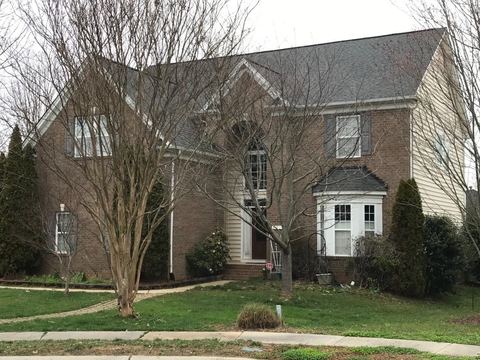 Brick two-story home with a new gray architectural shingle roof