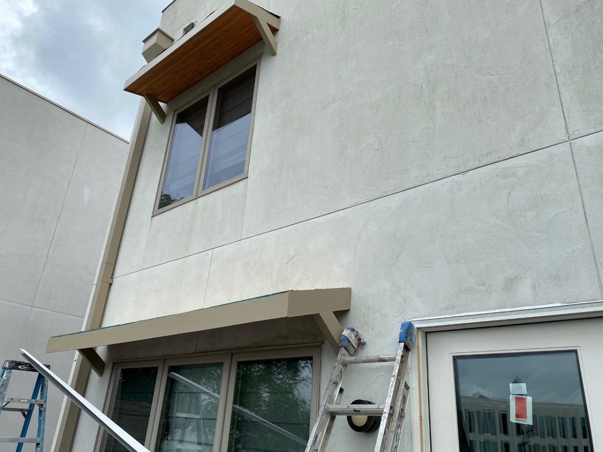 During building of Charlotte standing seam metal roof awnings