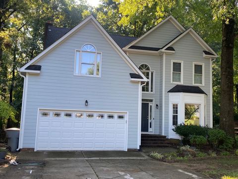 White fiber cement siding and trim on a two-story home with a two-car garage
