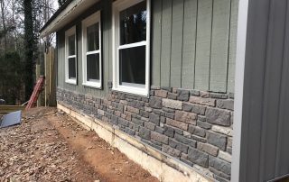 Details of insulated board and batten and brick vinyl combination