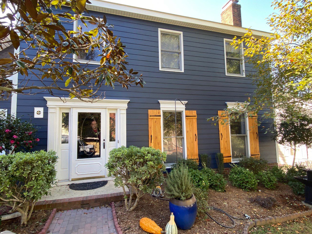 completed Hardie® Plank with cedar shutters